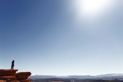 a person standing on top of a rock formation