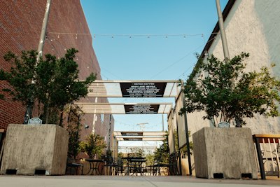 a restaurant with tables and chairs outside