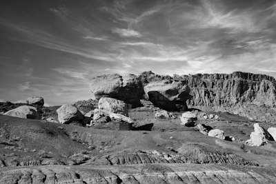 a rocky landscape with a cloudy sky