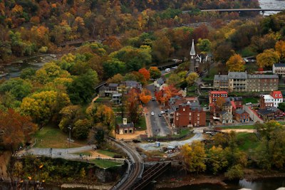an aerial view of a town surrounded by trees