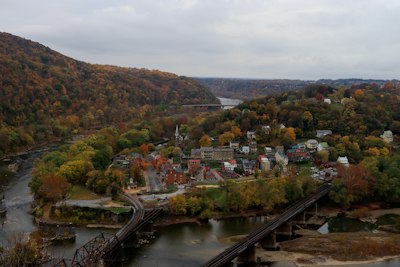 an aerial view of a town surrounded by trees