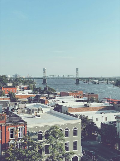 A view of a city with a bridge in the background
